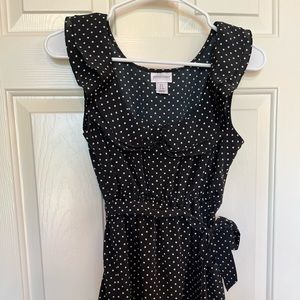 Silky black maternity top with white polka dots and sweet detailing